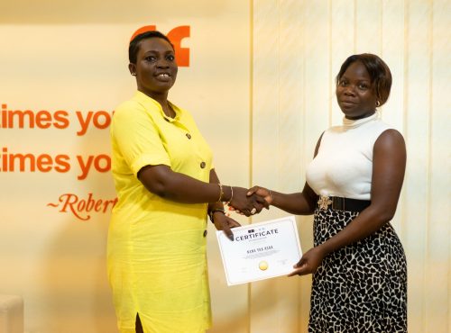 Aba Amoa awarding a GAREB accredit certificate to a student from the Accra school of Real Estate